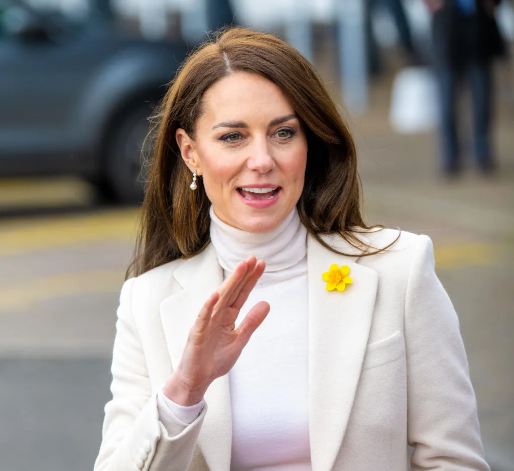 Kate Middleton in white suit jacket and top